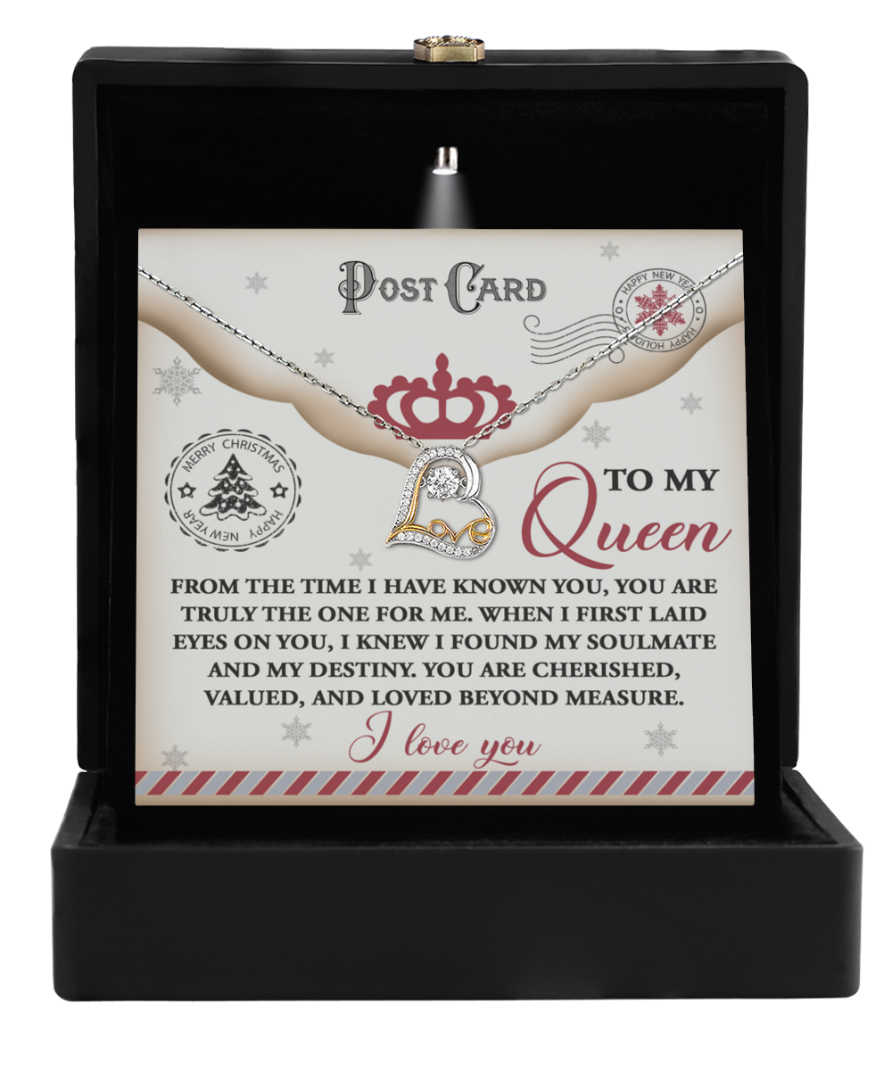 A jewelry box unveils the Soulmate-The One - Love Dancing Necklace accompanied by a card inscribed with "To My Queen," featuring a heartfelt message. The sophistication of 14k Gold enhances the profound emotions embodied in this timeless gift.