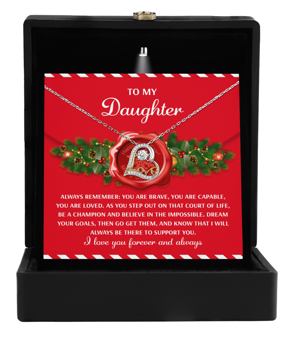 The Daughter-Be A Champion - Love Dancing Necklace with a heart-shaped 'D' pendant comes in a black box and includes a red card that reads, "To my daughter," along with motivational text.