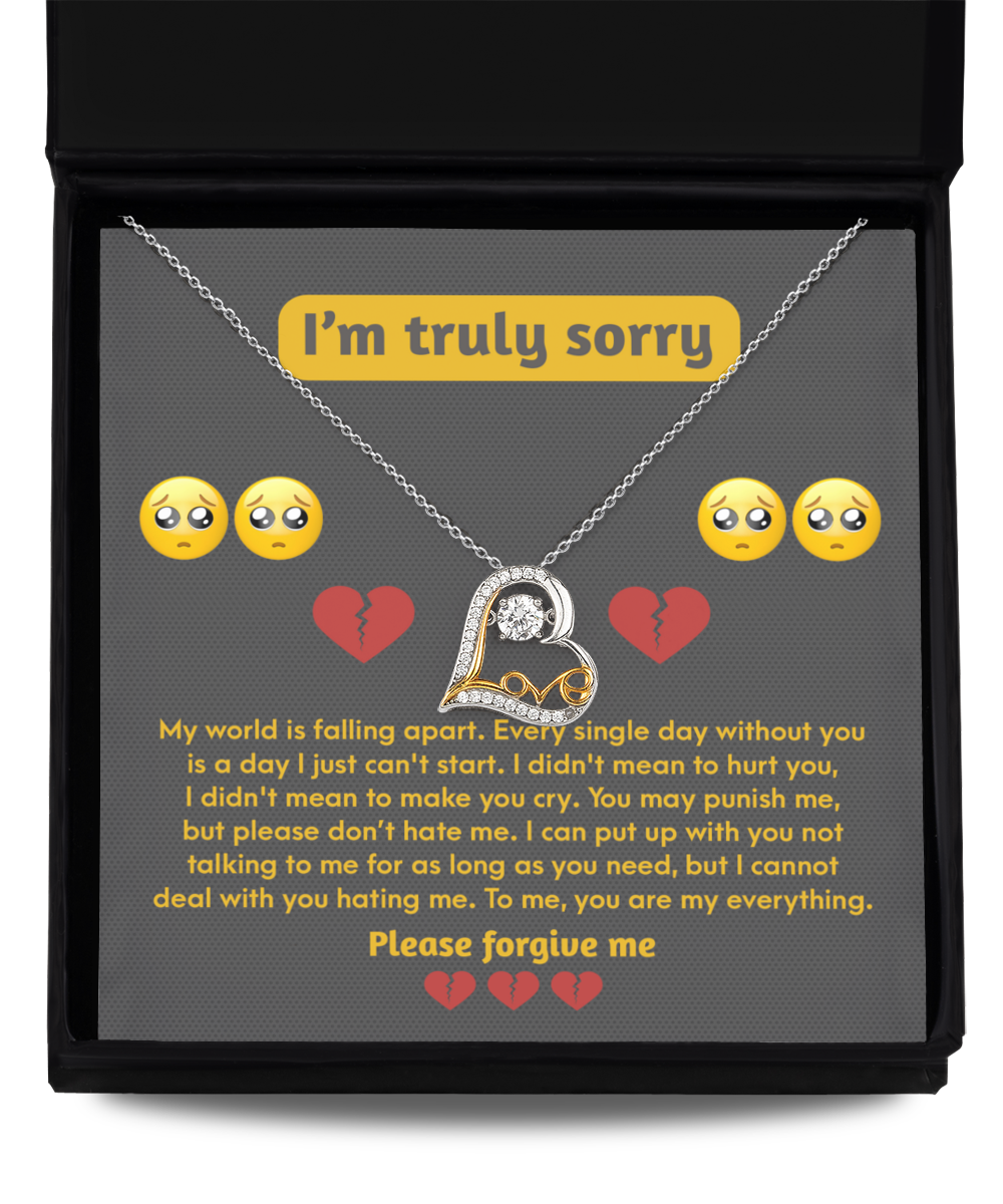 The *Sorry-Make You Cry - Love Dancing Necklace* presented in a black box includes a message reading "I'm truly sorry" and features a detailed apology note made of sterling silver with sad faces and broken heart emojis.