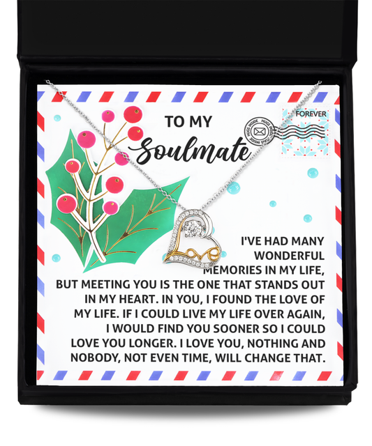 A Soulmate-Love You Longer - Love Dancing Necklace is nestled in a gift box alongside a card. The card includes decorative elements and a heartfelt message for a soulmate, perfectly complementing the elegance of the 14k gold piece inside.