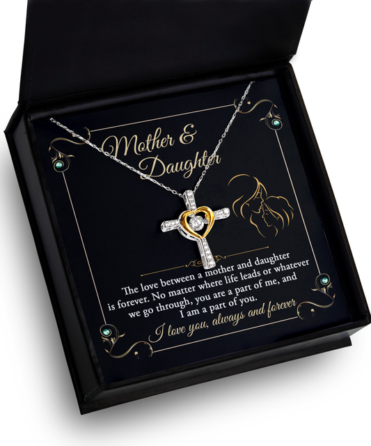 A heart-shaped Mother Daughter, Part Of Me - Cross Dancing Necklace in a box with "mother & daughter" text and a message about the love between a mother and daughter.