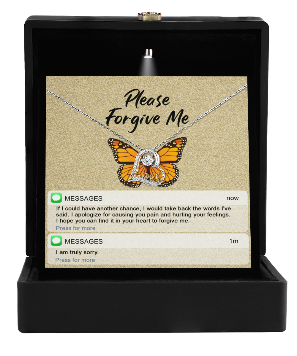 The Sorry-In Your Heart - Love Dancing Necklace features a butterfly pendant and a "Please Forgive Me" message with apology texts, symbolizing sincerity and crafted to mend hearts.