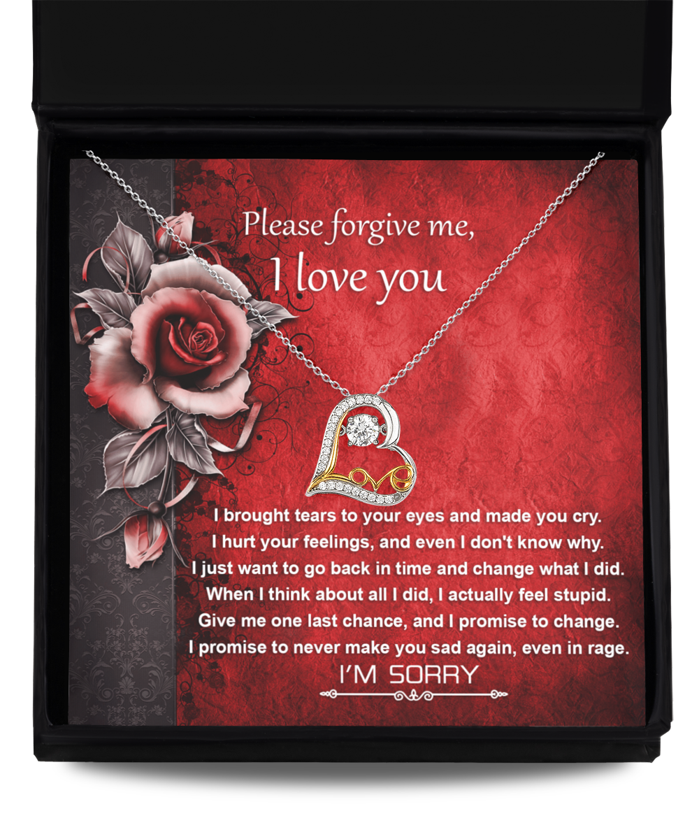 The Sorry-One Last Chance - Love Dancing Necklace, a 14k gold necklace featuring a heart pendant, is beautifully displayed above a heartfelt message reading "Please forgive me, I love you," set against a vibrant red floral background.