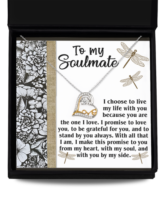 This sterling silver necklace, named the "Soulmate-Make This Promise - Love Dancing Necklace," features a 14k gold heart pendant elegantly displayed on a card adorned with floral and dragonfly designs. The card beautifully conveys love and commitment, making it an ideal gift that dances with emotion.