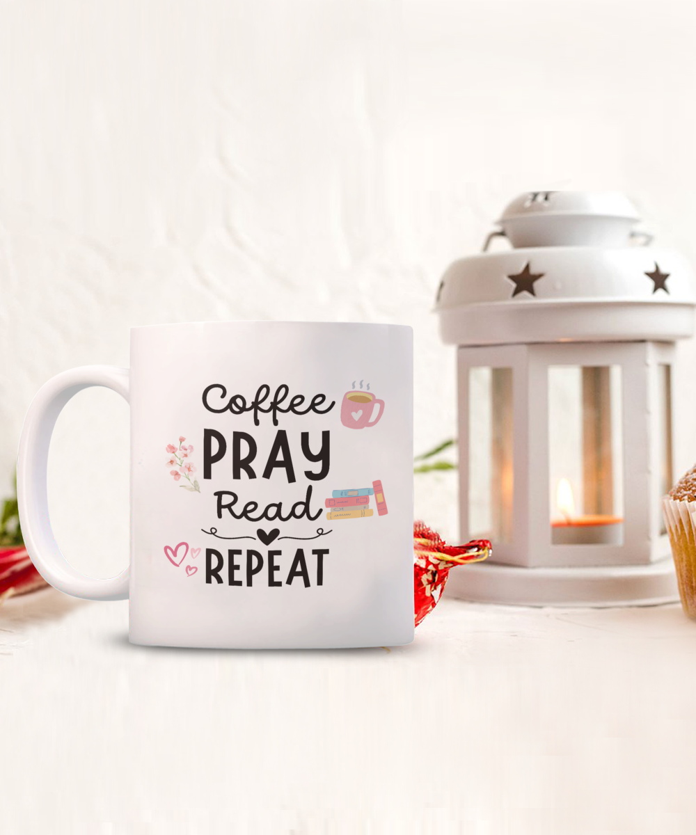 A "Coffee Pray Read Repeat" white mug, printed and shipped from the USA, sits near a lit lantern along with a cupcake and decorative items. This unique "Best Gift" mug for readers is a limited-time treasure not available in stores.