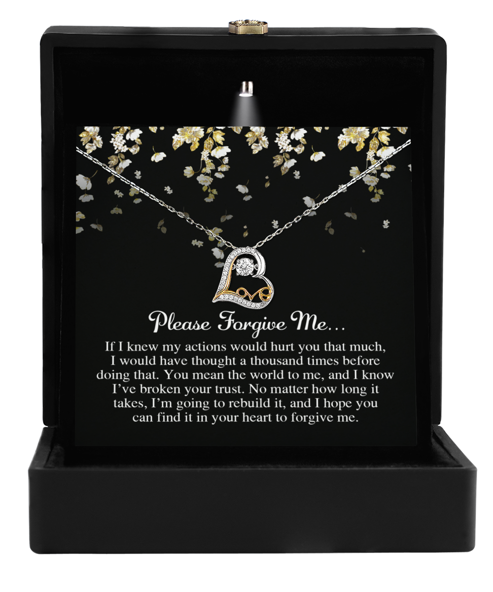 Open the black box to reveal the "Sorry-Broken Your Trust - Love Dancing Necklace," a stunning Sterling Silver heart-shaped piece. Inside, you'll find a heartfelt card that reads, "Please Forgive Me..." followed by an apology message expressing deep regret for any hurt caused and earnestly requesting forgiveness.