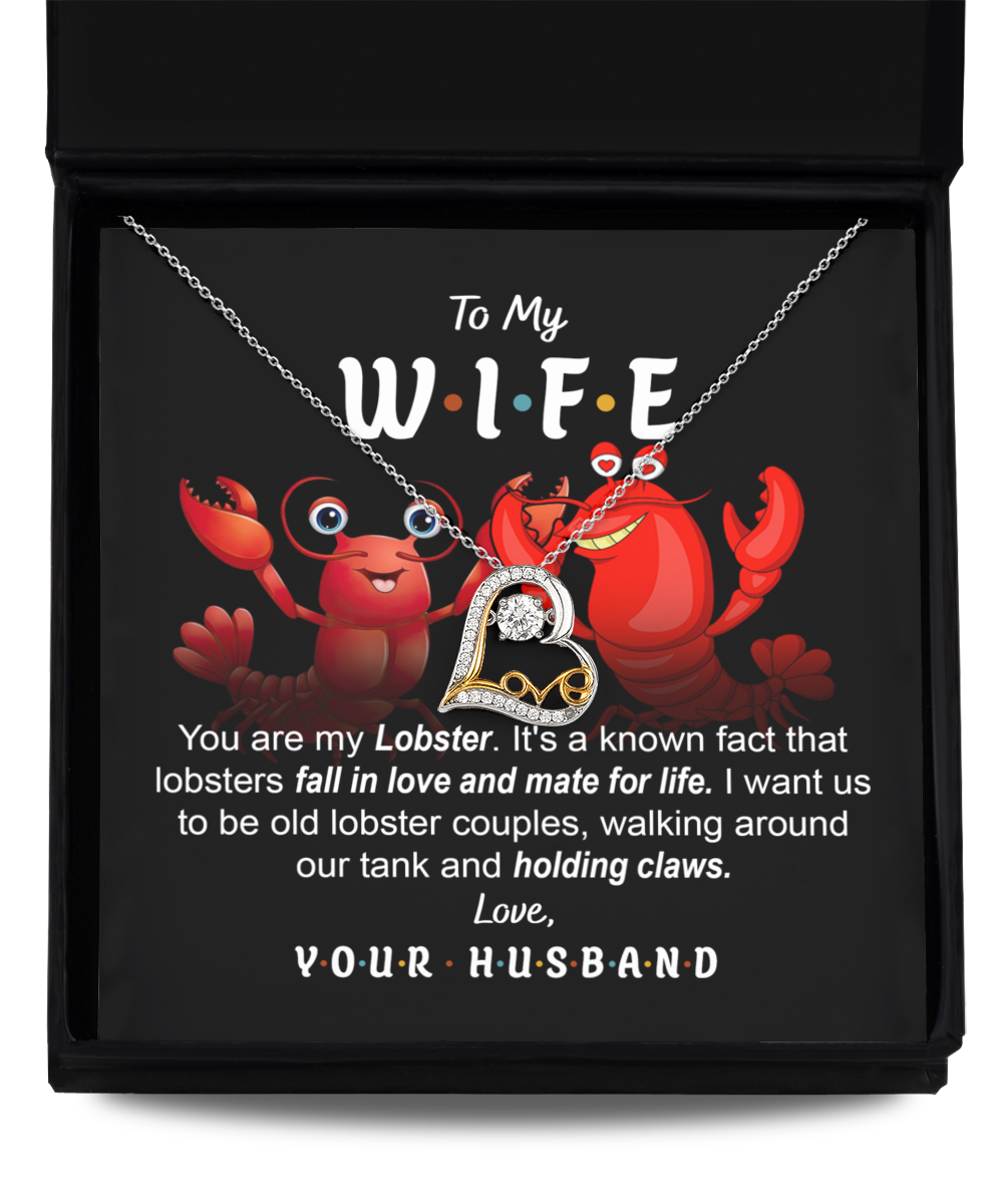 A box with a lobster-themed necklace crafted in .925 Sterling Silver and a message that reads: "To My W.I.F.E. You are my Lobster. Love, Your Husband." The background shows cartoon lobsters contains the Wife-Old Lobster Couples - Love Dancing Necklace.