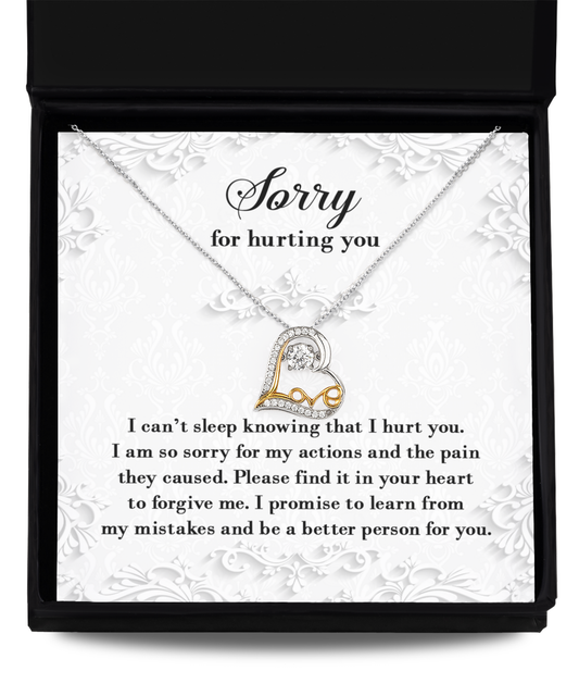 A 14k gold "Sorry-Can't Sleep - Love Dancing Necklace" in an open box with a heartfelt message of apology, expressing regret for causing pain and a promise to learn from mistakes. The text is elegantly displayed on a decorative background.