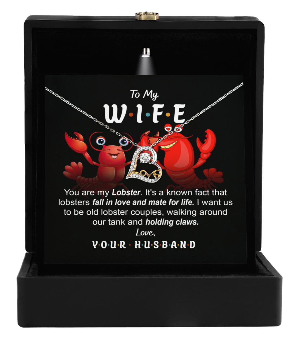 The Wife-Old Lobster Couples - Love Dancing Necklace is an ideal gift for your wife, presented in an adorable lobster-themed box. The box, adorned with playful red cartoon lobsters, opens to reveal a stunning 14k gold pendant encrusted with diamonds, promising to mesmerize and bring joy each time she looks at it.