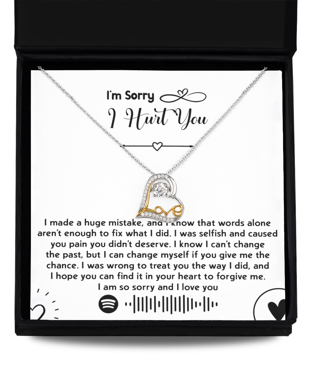 Introducing the "Sorry-You Didn't Deserve - Love Dancing Necklace," featuring a 14k gold heart-shaped pendant nestled neatly inside a box. Accompanying the necklace is an apology note expressing sincere regret and seeking forgiveness, along with a Spotify code.