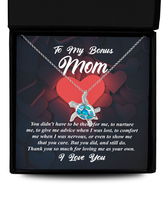 A To Bonus Mom, That You Care - Opal Turtle Necklace in a Gearbubble gift box with a message for a "bonus mom," symbolizing love.