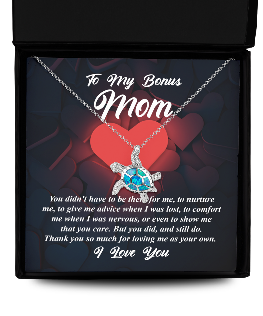 A To Bonus Mom, That You Care - Opal Turtle Necklace in a Gearbubble gift box with a message for a "bonus mom," symbolizing love.