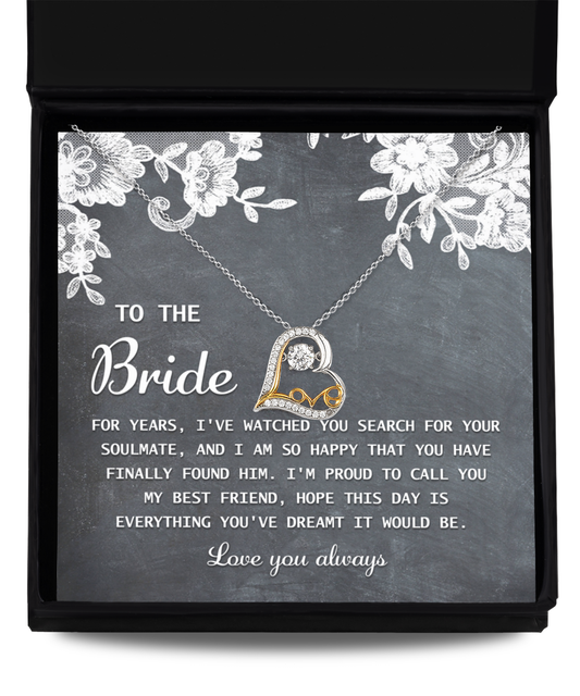 A heart-shaped 14k gold "To Bride-My Best Friend - Love Dancing Necklace" rests atop a card with a message to the bride, expressing joy for finding her soulmate and wishing the day to be everything she dreamed of.