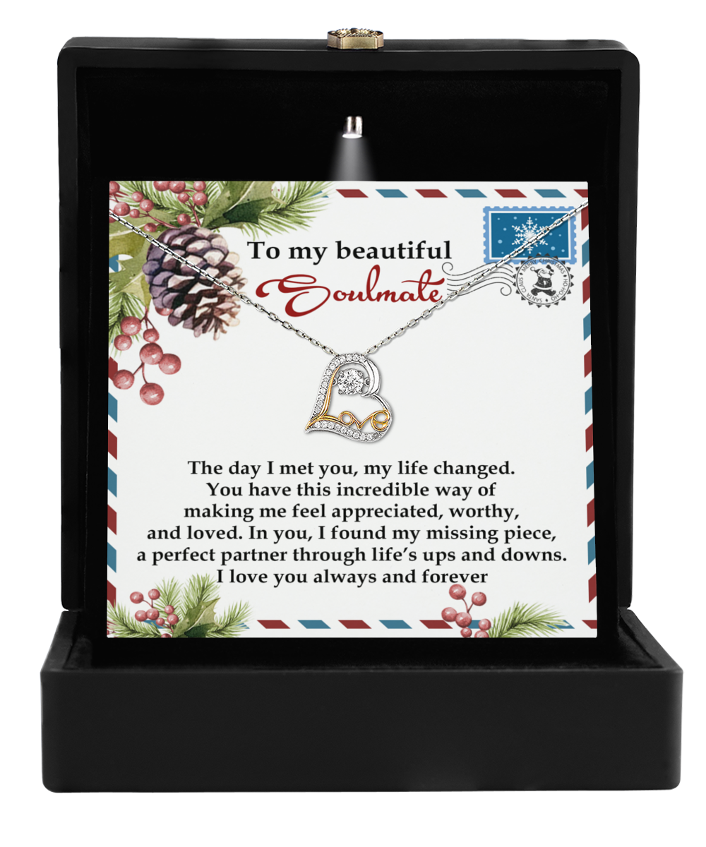 The Soulmate-Perfect Partner - Love Dancing Necklace, featuring a heart-shaped pendant, is beautifully showcased in a black box. Crafted from shimmering sterling silver, the background card reads: "To my beautiful soulmate" along with an affectionate message.