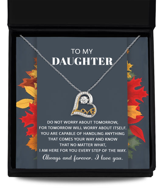 The Daughter-Comes Your Way - Love Dancing Necklace gift box includes a sterling silver necklace with intertwined heart shapes and a small diamond, accompanied by a message card that reads "To My Daughter" with a supportive message below. The background features autumn leaves, creating a picturesque and meaningful gift.