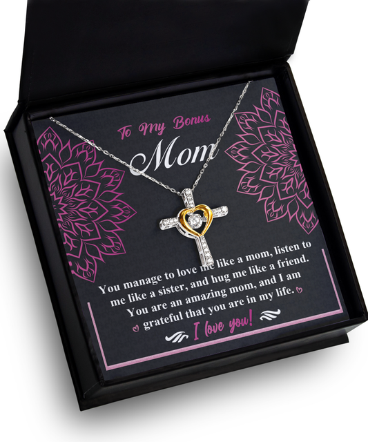 A necklace in a gift box with a heartfelt message to a "bonus mom," featuring a heart-shaped pendant and floral designs. This To Bonus Mom, An Amazing Mom - Cross Dancing Necklace serves as an ideal Gift for Mother, symbolizing love.