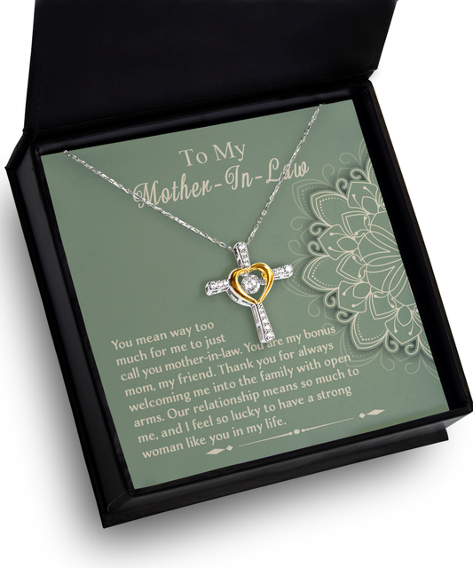 A heart-shaped, 14k gold plated To Mother-In-Law, A Strong Woman - Cross Dancing Necklace in a gift box with a message for a mother-in-law, expressing gratitude and appreciation.
