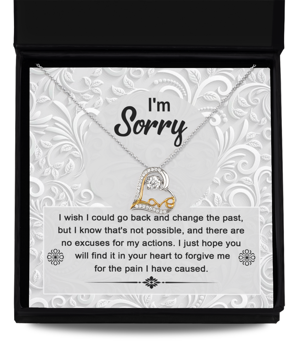 The Sorry-Change The Past - Love Dancing Necklace, a 14k gold piece with a heart-shaped pendant, is presented in a box with the heartfelt message: "I'm Sorry. I wish I could go back and change the past, but I know that's not possible... for the pain I have caused.