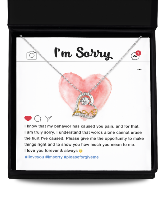 The Sorry-Cannot Erase - Love Dancing Necklace features a heart-shaped pendant and is presented on a card with a heartfelt apology message, expressing deep sorrow and a plea for forgiveness. Made from .925 Sterling Silver, the necklace hangs gracefully against the red heart background of the social media-style card.