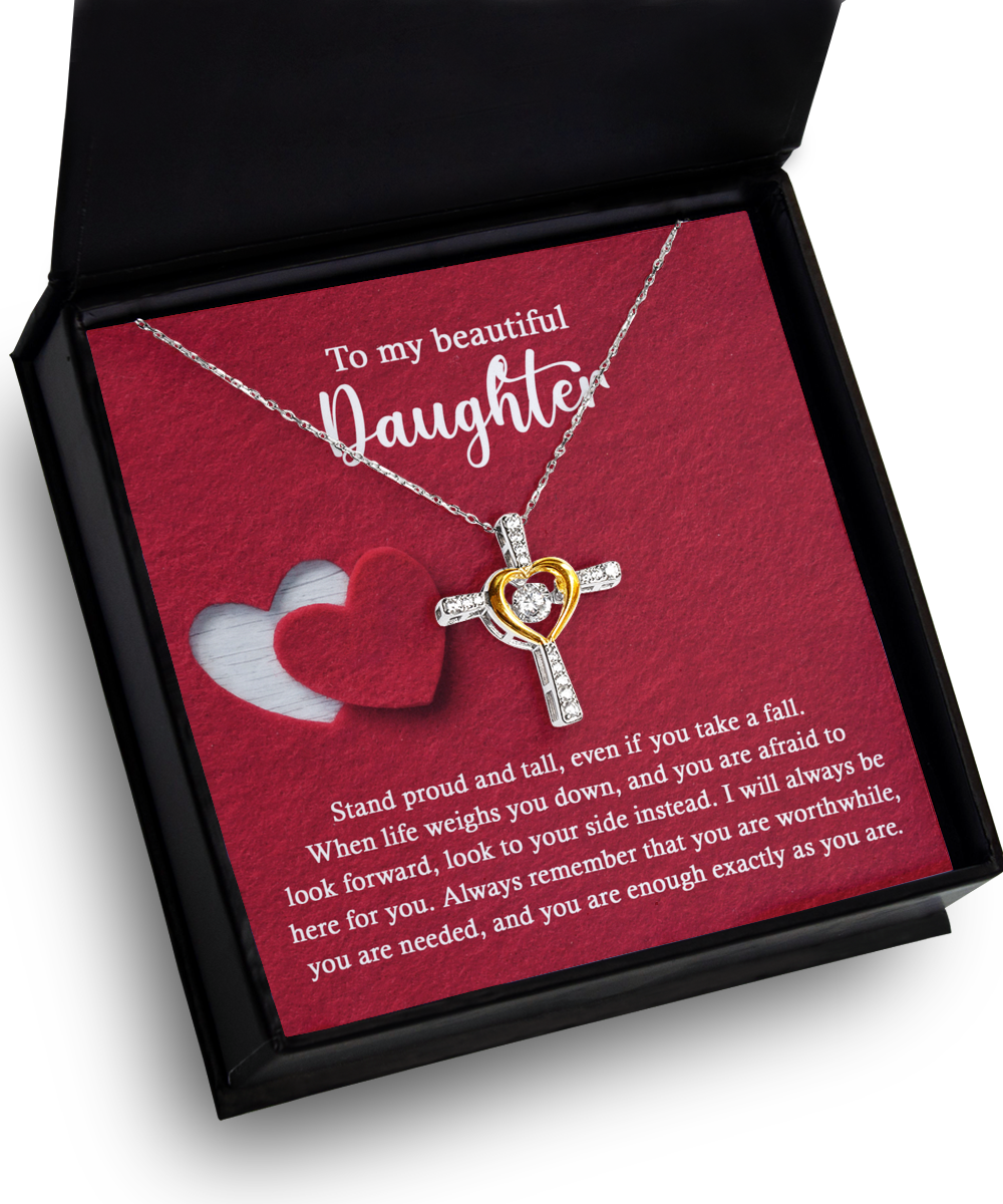 An open black box reveals the stunning "To Daughter-As You Are - Cross Dancing Necklace," featuring a heart intertwined with a cross in 14k gold. The box also includes an inspirational message addressed to a daughter.