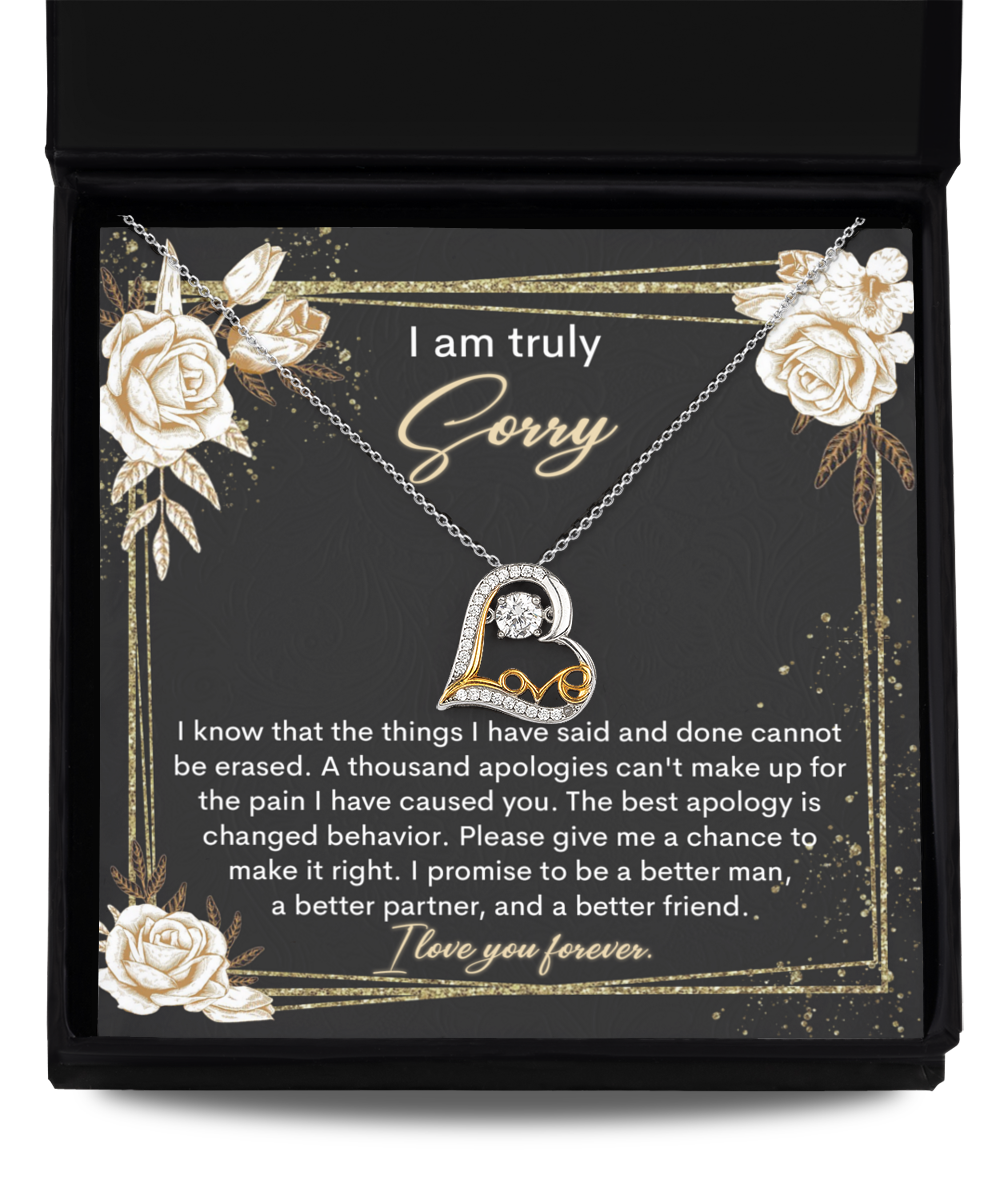 A "Sorry-Cannot Be Erased - Love Dancing Necklace" comes in a box with an apology note that reads, "I am truly sorry. I promise to be a better man, a better partner, and a better friend. I love you forever.