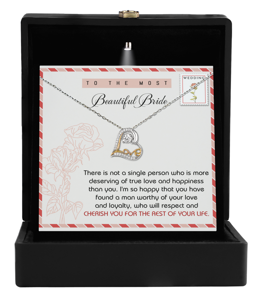 The Bride-Of Your Life - Love Dancing Necklace, featuring floral designs and a romantic message, comes beautifully nestled in a black box with a card that says, “To the most beautiful bride.” This elegant gift is perfect for expressing love on her special day.