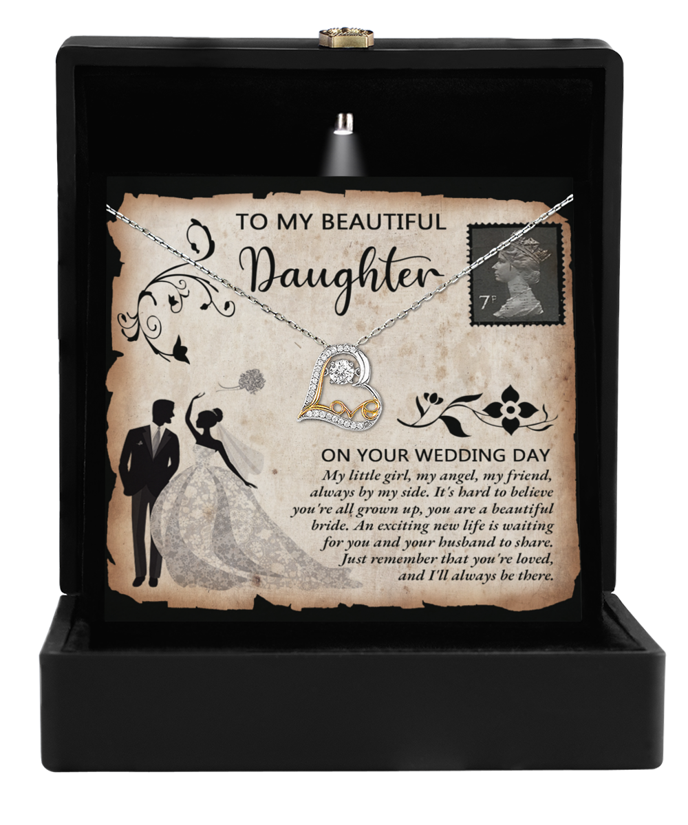 The Daughter Wedding-Beautiful Bride - Love Dancing Necklace, presented in a gift box with a message card that reads "To my beautiful daughter on your wedding day," showcases a heart pendant and an illustration of a bride and groom, making it the perfect symbol of maternal love for a daughter's wedding gift.