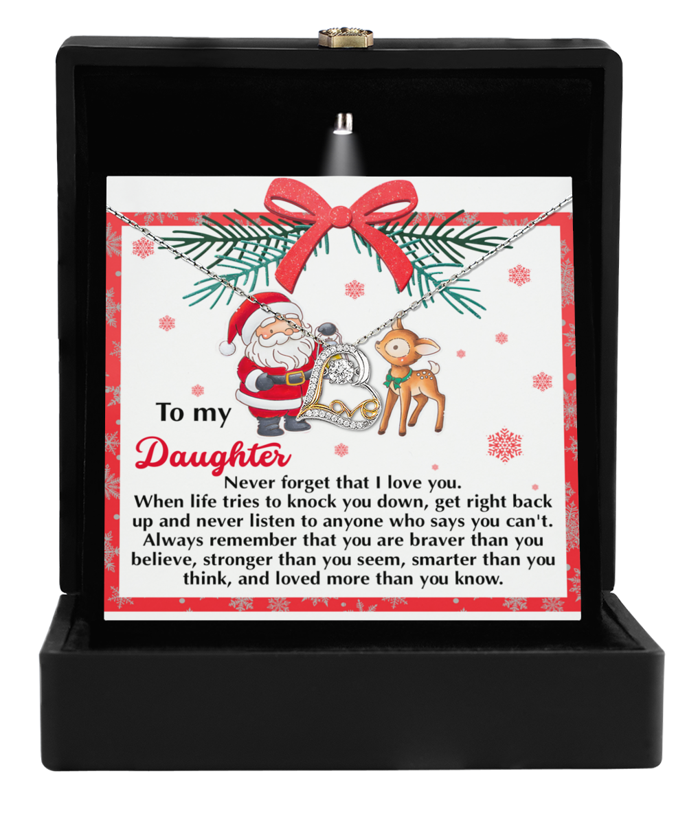 The Daughter-Get Back Up - Love Dancing Necklace, crafted in Sterling Silver, is beautifully presented in a box alongside a card adorned with Santa and a reindeer. The card includes an inspiring message for your daughter about resilience and love, making this necklace the ideal heartfelt gift for the holiday season.