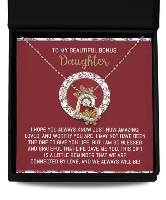 Introducing the Grandma-Eternal Sunflower - Love Dancing Necklace: A stunning piece crafted from .925 sterling silver, featuring a circular pendant adorned with a decorative "D" on a vibrant red background. This necklace carries a heartfelt message of love and gratitude for a "bonus daughter," beautifully capturing the essence of joy and connection akin to love dancing.