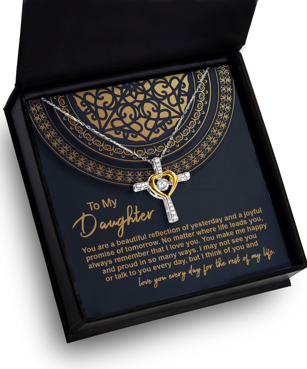 The "To Daughter-Beautiful Reflection - Cross Dancing Necklace" features a heart pendant in .925 Sterling Silver, elegantly presented in a black and gold gift box. Inside the box is a heartfelt message to a daughter, expressing pride, love, and happiness for her.