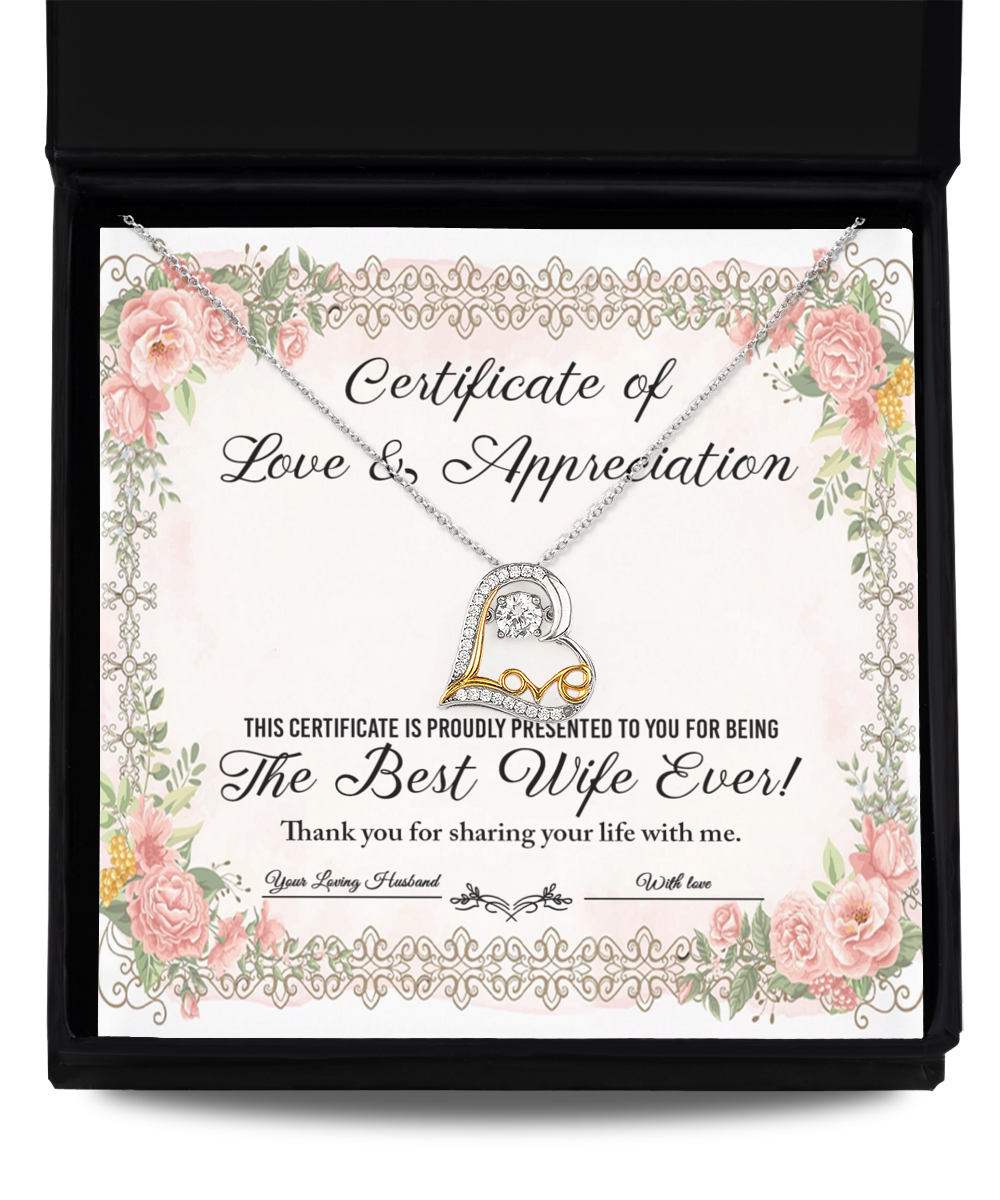 A "To Wife - Love & Appreciation" certificate adorned with floral borders and showcasing a heart-shaped, sterling silver Love Dancing Necklace, acknowledging the recipient as "The Best Wife Ever.