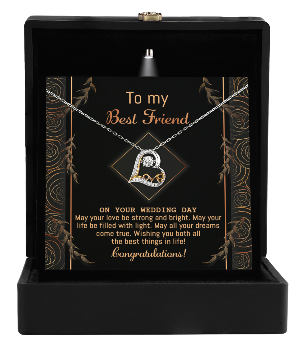 The Best Friend Wedding-Strong And Bright - Love Dancing Necklace, crafted in 14k gold with interlocking rings, comes elegantly nestled in a black box alongside a card that reads: "To my Best Friend, On your wedding day. Congratulations!" It's the perfect gift to celebrate this special occasion.