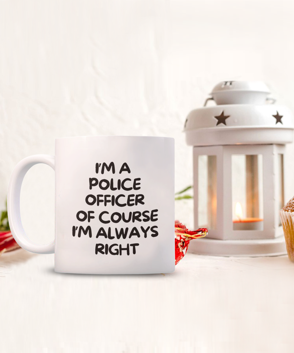 The "I'm A Police Officer Of Course I'm Always Right" coffee mug, ideal as a gift or appreciation cup, is shown next to a white lantern and partially visible baked treat. This unique item, printed and shipped from the USA, is available for a limited time only.