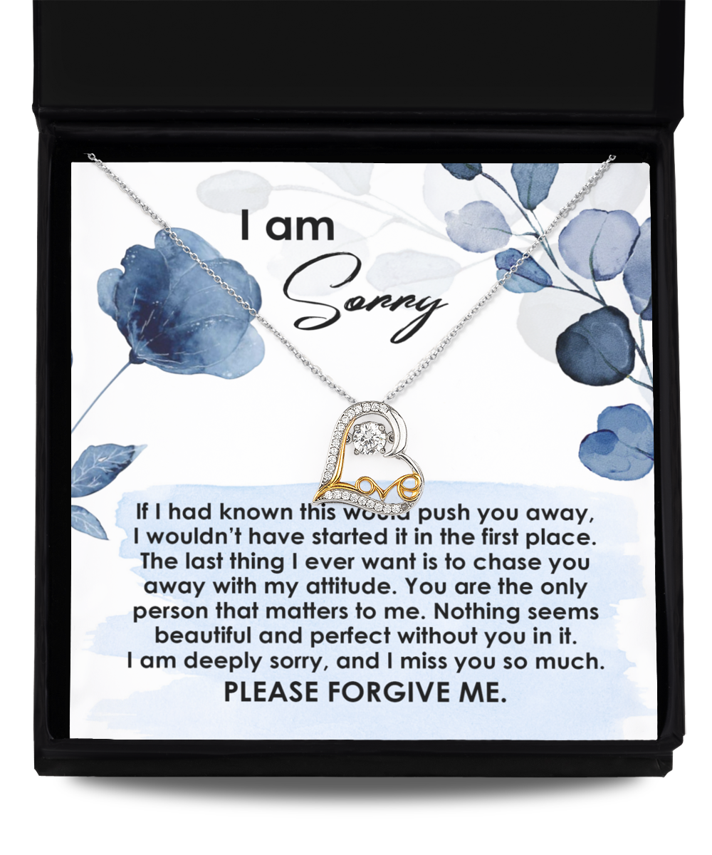 Displayed in a black box, the Sorry-Push You Away - Love Dancing Necklace features a beautiful heart pendant and is meticulously crafted in 14k gold. The box includes an apology note that reads "I am sorry," accompanied by a heartfelt message expressing deep regret and a sincere plea for forgiveness.