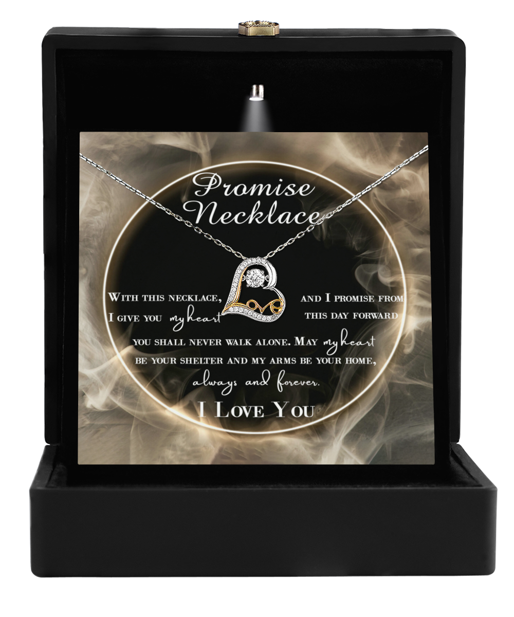 The "To Wife, Promise Necklace - Love Dancing Necklace," a silver piece featuring a heart pendant, is elegantly showcased in an open black box. It includes a heartfelt printed message about promises and love, enhancing its charm and significance.