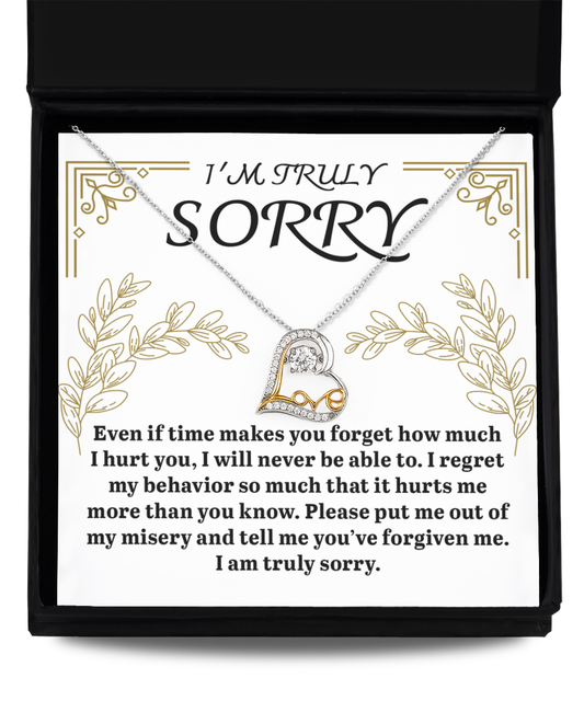 Open the box containing the exquisite "Sorry-It Hurts Me - Love Dancing Necklace," featuring a stunning 14k gold pendant, and a printed apology message that reads "I'M TRULY SORRY." The message expresses heartfelt regret for causing pain and seeks forgiveness.