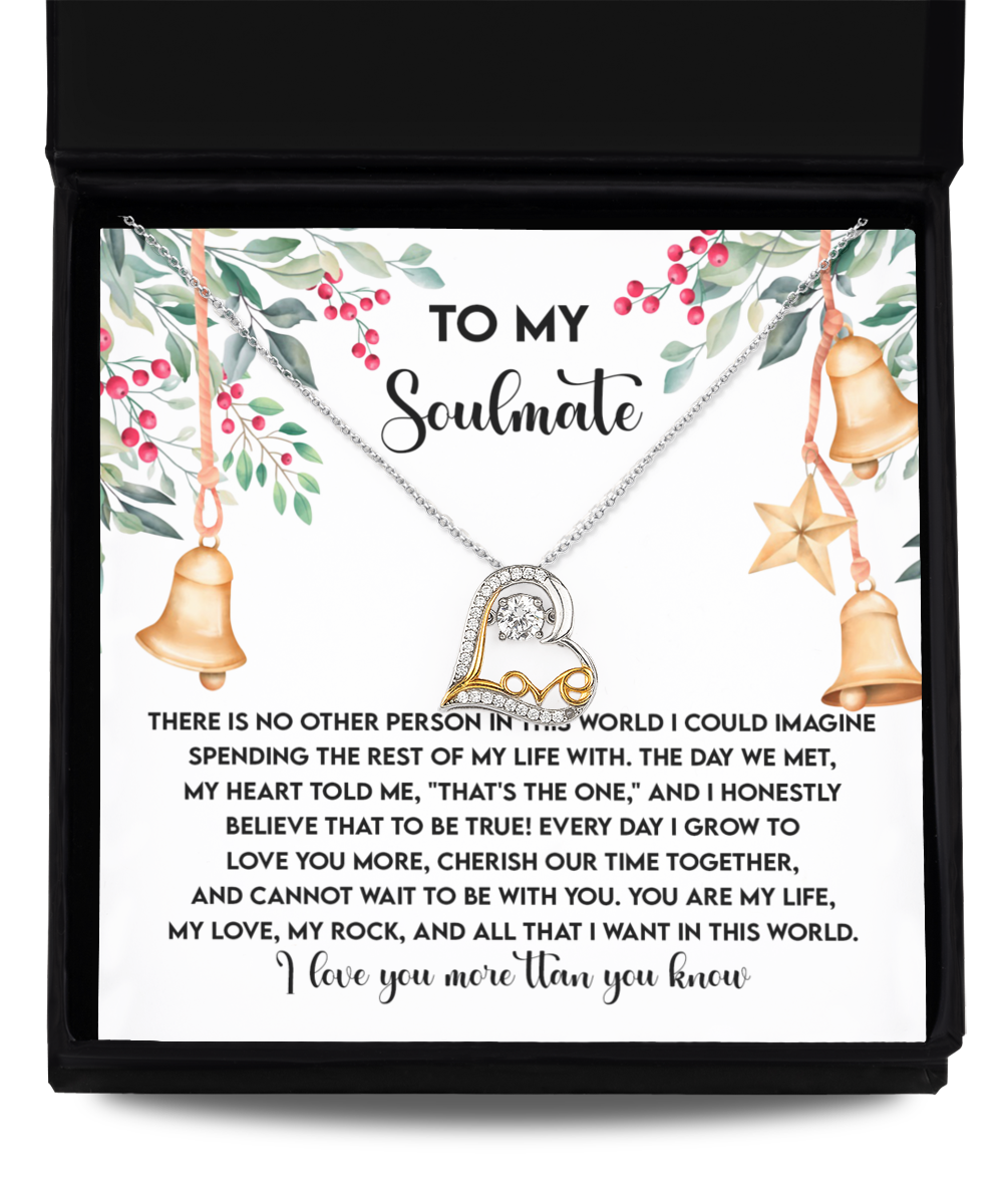 The Soulmate-Be With You - Love Dancing Necklace is an ornate heart-shaped pendant crafted from sterling silver, elegantly displayed on a card featuring a romantic message titled "To My Soulmate" and adorned with bells and star motifs.