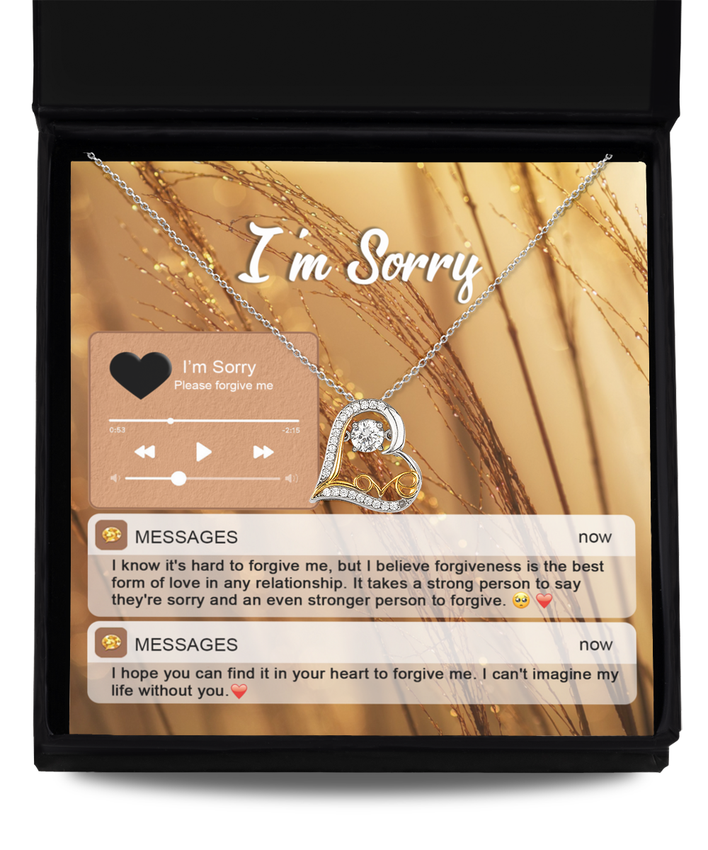 The Sorry-Person To Forgive - Love Dancing Necklace features a heart-shaped pendant crafted from sterling silver with 14k gold accents, presented in a box that reads "I'm Sorry." Included are two text messages expressing apologies and seeking forgiveness, accompanied by an audio player interface displaying "I'm Sorry.