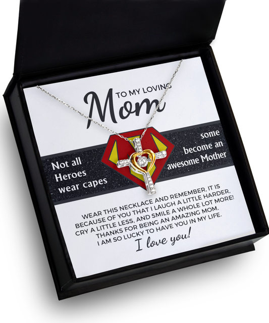 A necklace with a heart-shaped pendant in a box labeled "to my loving mom" with a message appreciating mom as a hero and expressing love and gratitude, serves as the perfect To Mom, Awesome Mother - Cross Dancing Necklace.