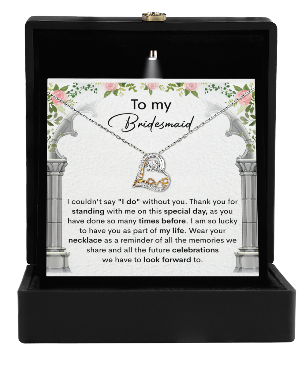 The Bridesmaid-Standing With Me - Love Dancing Necklace is elegantly displayed in a black box. It comes with a card that expresses gratitude for support and shared memories.