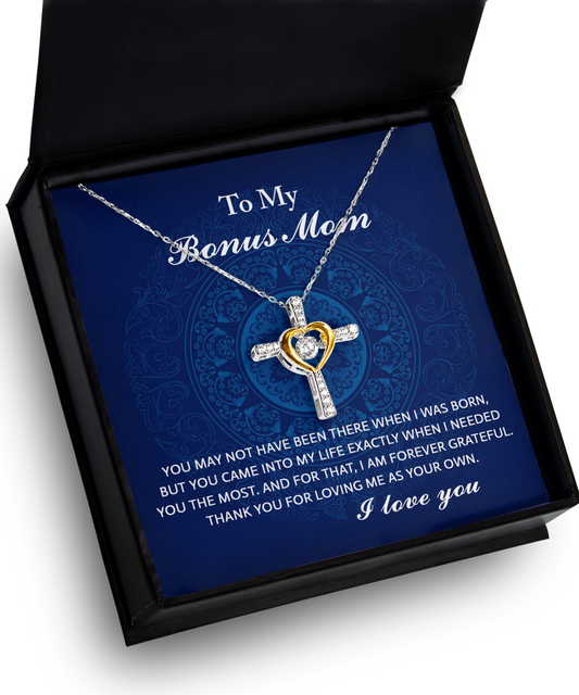 Heart-shaped pendant necklace with diamond in gift box, engraved "to my To Bonus Mom, I Needed You," on a blue ornate background, expressing love and gratitude. This 14k gold plated necklace showcases elegance and heartfelt