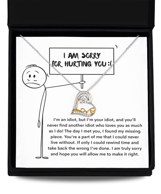 The Sorry-Missing Piece - Love Dancing Necklace, crafted from .925 Sterling Silver, comes in a box with a heartfelt apology note featuring a cartoon stick figure holding an "I am sorry for hurting you" sign.