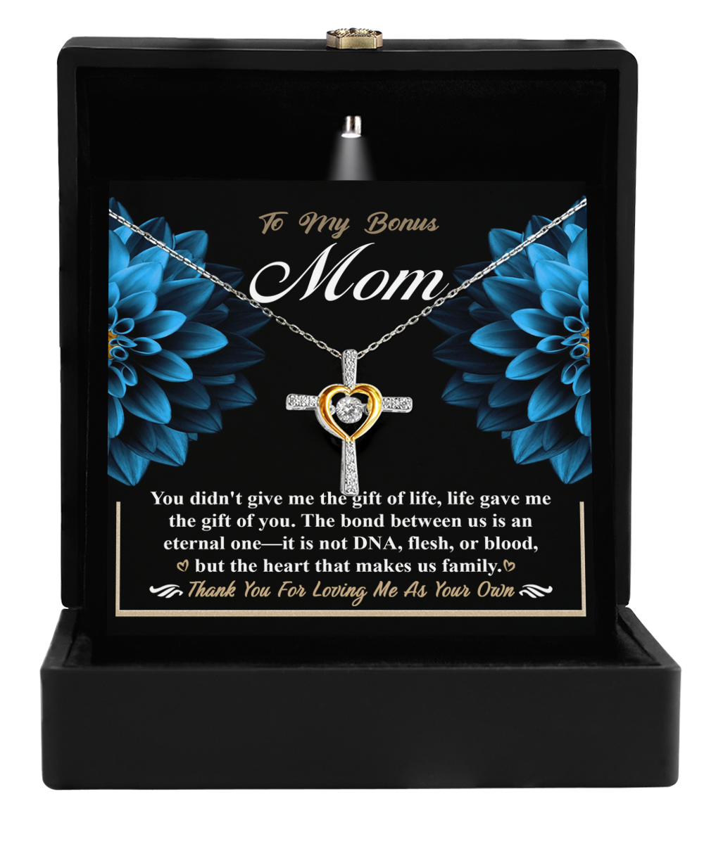 A heart-shaped "To Bonus Mom, Gift Of You" Cross Dancing Necklace by Gearbubble with an appreciation message for a stepmother, presented in a black gift box.