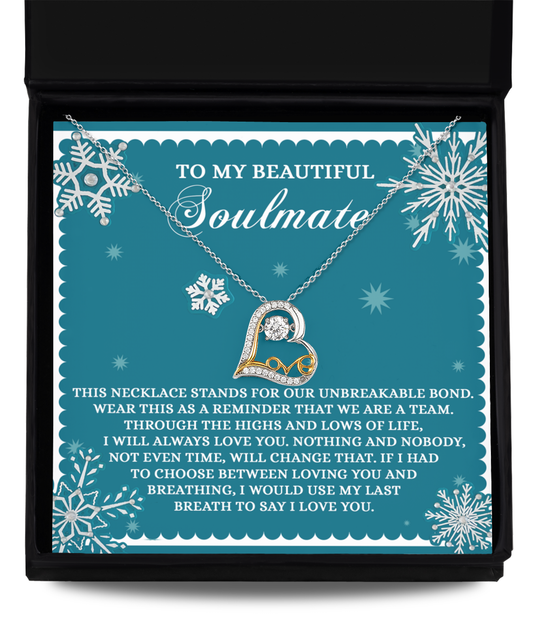 The Soulmate-A Team - Love Dancing Necklace, featuring a heart-shaped design crafted in sterling silver with delicate snowflake embellishments, arrives beautifully packaged in a box containing a heartfelt message for your soulmate.