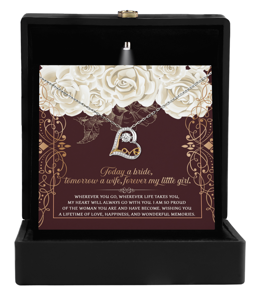 The "To Daughter Wedding-Wonderful Memories - Love Dancing Necklace," featuring a heart pendant, is elegantly displayed in an open black box and comes with a card adorned with floral designs and a heartfelt message for the bride.