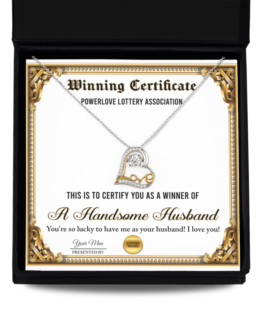 The "To Wife-Winning Certificate - Love Dancing Necklace," featuring a certificate labeled "Winning Certificate" and a heart-shaped sterling silver necklace plated in 14k gold, is presented in a black box. The certificate reads "A Handsome Husband" along with a congratulatory message.