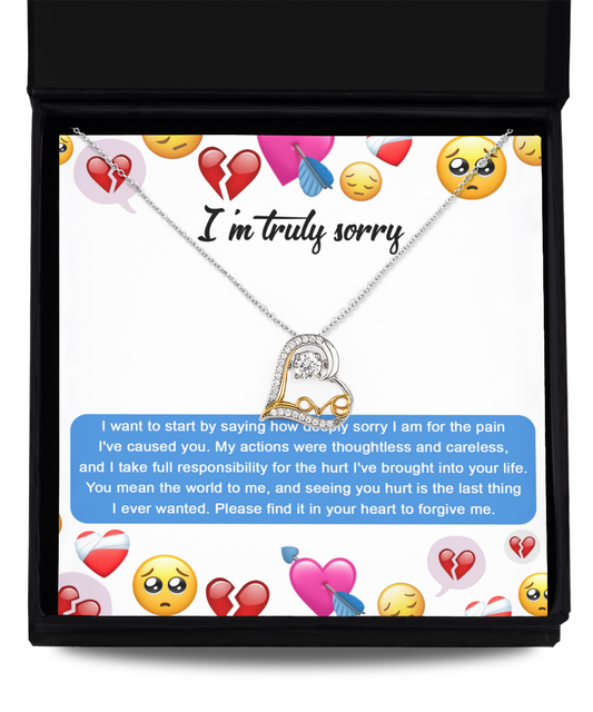 The "Sorry-How Deeply Sorry - Love Dancing Necklace," crafted from .925 Sterling Silver and featuring a double heart pendant, is showcased in a box. The background includes emoticons symbolizing sadness and broken hearts, accompanied by an apology message accepting responsibility for causing pain.