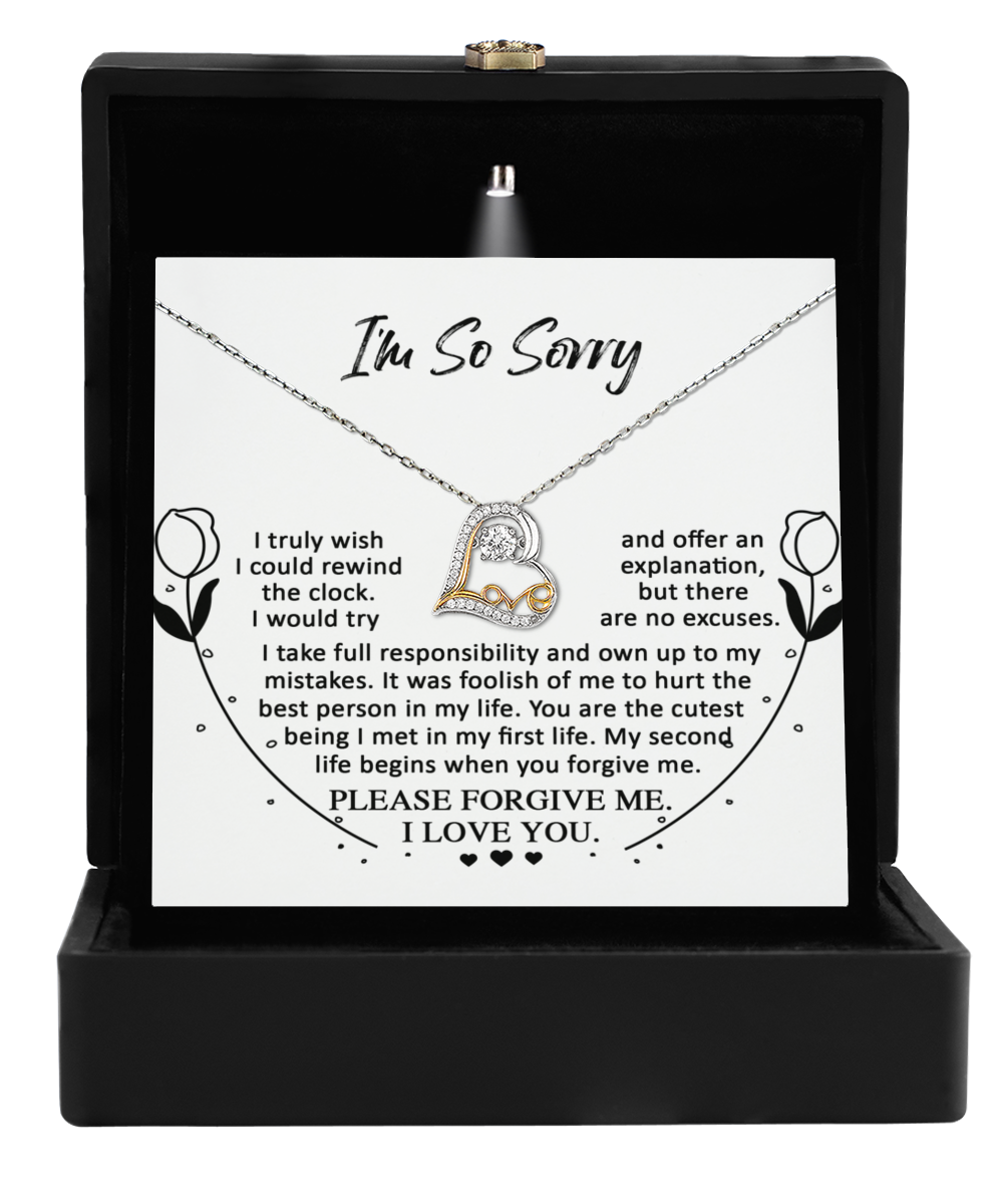 A stunning Sterling Silver "Sorry-My First Life - Love Dancing Necklace" carefully placed in a black jewelry box, featuring a heartfelt note that expresses deep regret, responsibility, and a plea for forgiveness with unmatched elegance.