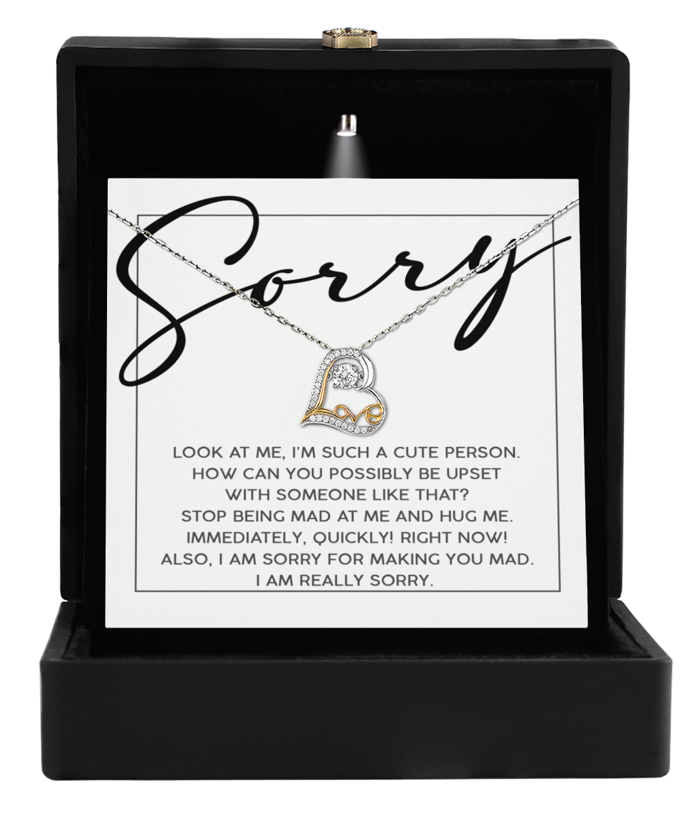 The Sorry-Someone Like That - Love Dancing Necklace comes in a sleek black box with a "Sorry" card, featuring a silver heart pendant—a timeless emblem of love and reconciliation.