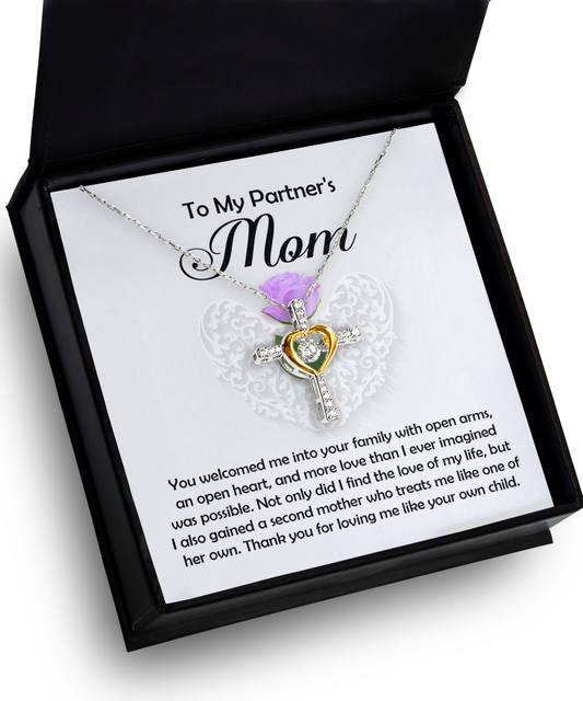 A heart-shaped pendant with a To Partner's Mom, A Second Mother - Cross Dancing Necklace inside, enclosed in a gift box with a heartfelt message to a partner's mother. This 14k gold plated necklace captures the essence of elegance and affection.